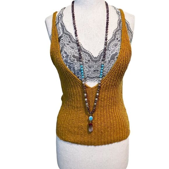 Free People  |||  rusty gold tank. You can wear the plunging side front or back. - Picture 1 of 10
